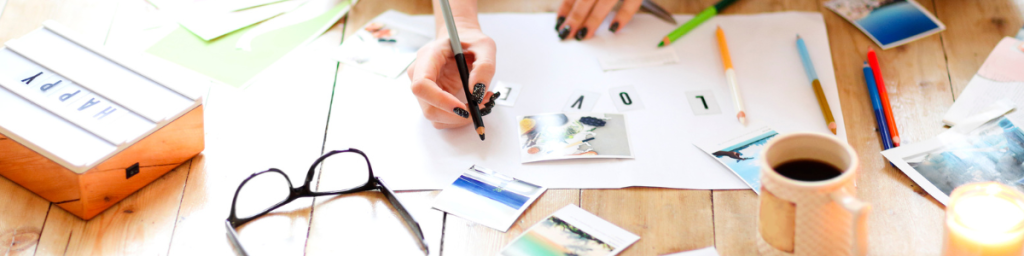 Person sitting working on creating a vision board.  