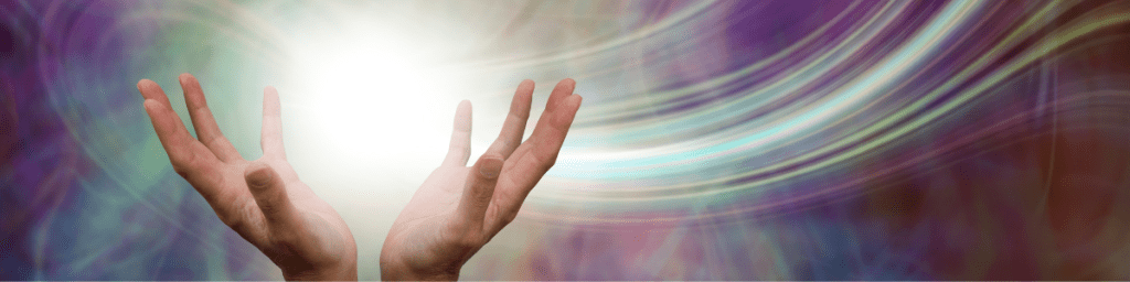 hands with light and color emanating from them