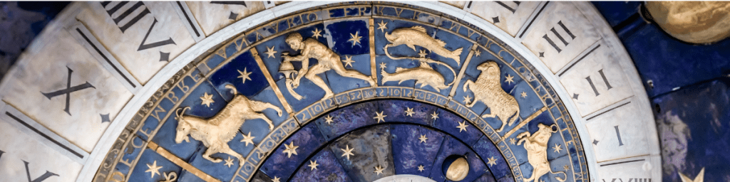 Zodiac signs on a wheel with the focus on the sign of Aquarius.