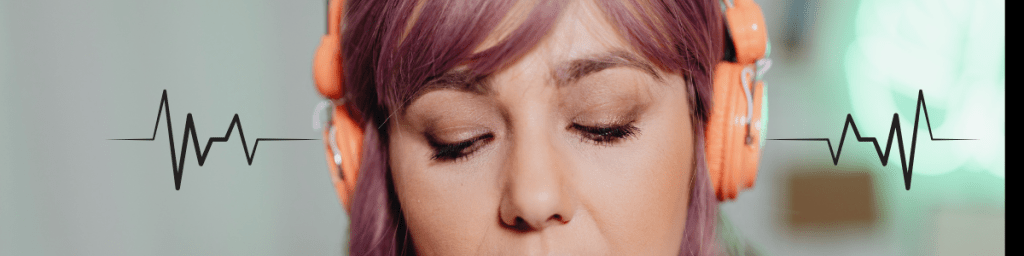 Woman listening to binaural beats through headphones.