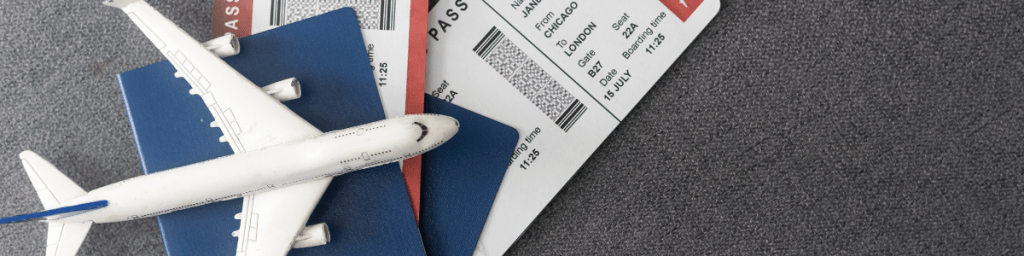 Boarding Passes, passports and a model plane for international travel.
